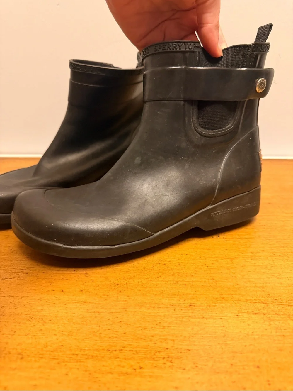Sperry Black Ankle Rain Boots with Orange Logo Accent